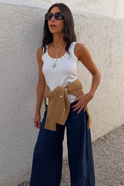 White Studded Rib Vest with gold stud detailing, styled with wide-leg jeans and a camel knit layer.