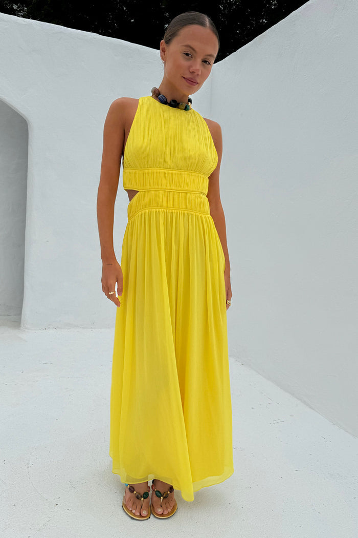 Yellow Ella Dress featuring intricate pleat detailing and side cut-outs in a flowy, feel good silhouette.