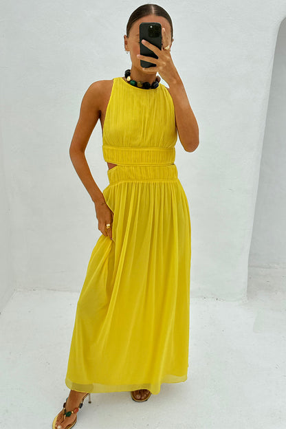 Yellow Ella Dress featuring pleated detailing and side cut-outs, styled for feel good dressing in a mirror selfie.